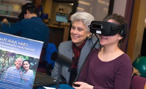 A physician assistant student wears a VR headset 